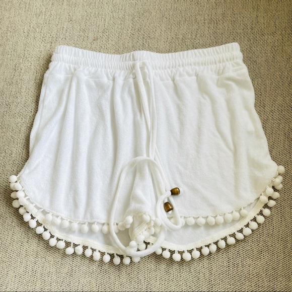 Brandy Melville Pants - NWOT women’s white pom pom shorts made in Greece!